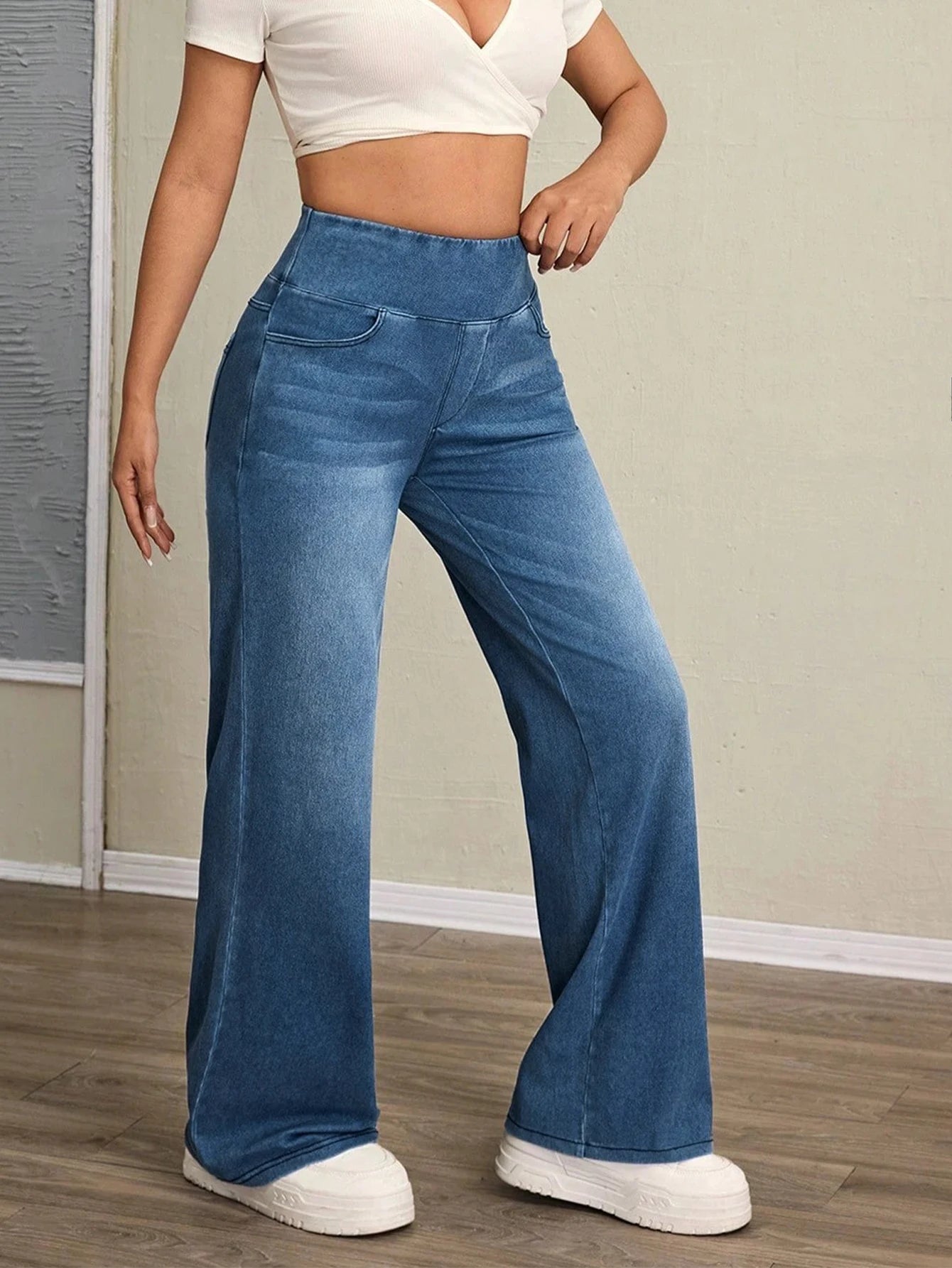 Women's high-rise wide-leg jeans with tummy tuck, slim fit, made from stretch denim fabric, are stylish for casual everyday wear